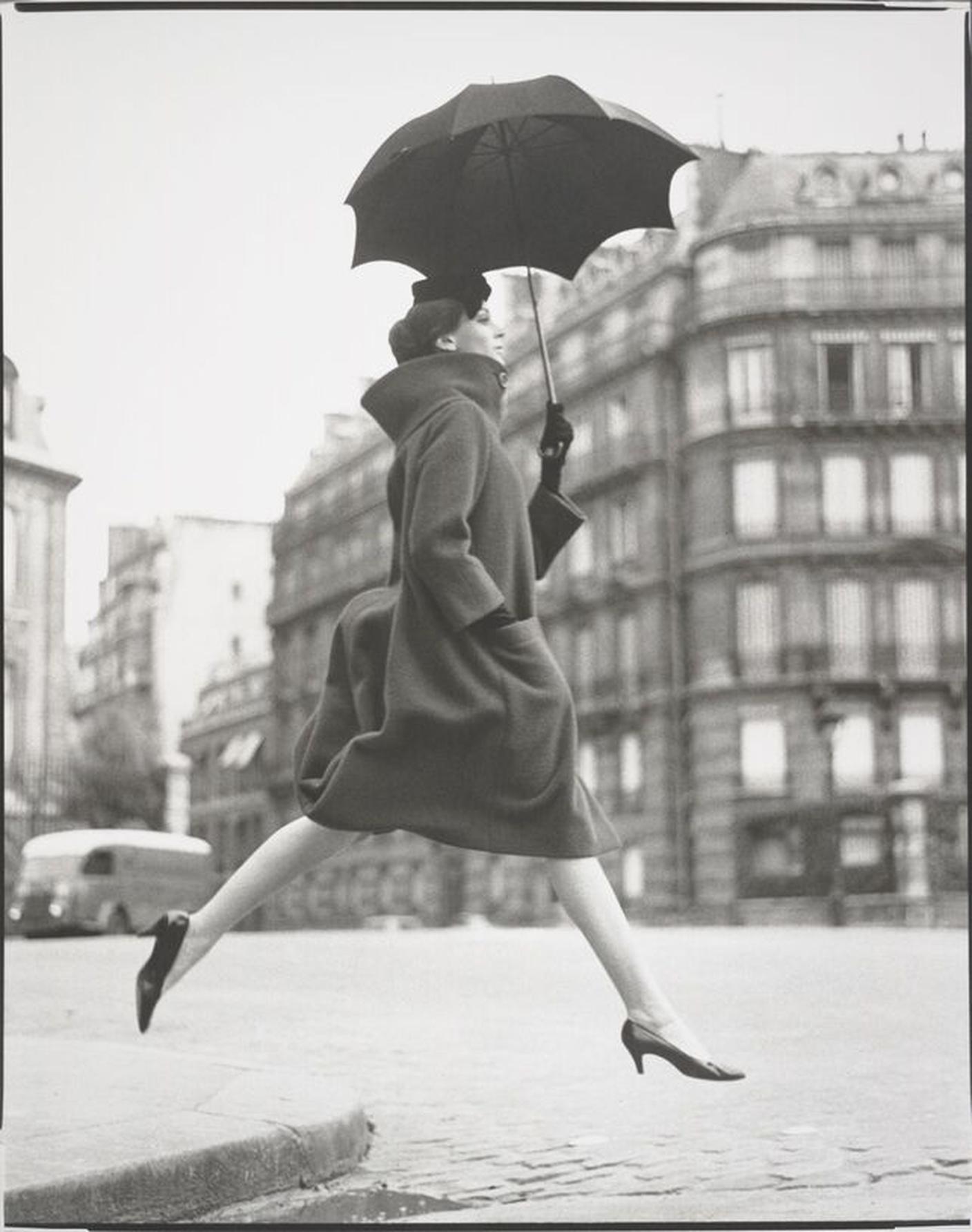 Richard Avedon, Carmen (homage to Munkácsi), coat by Cardin, Place François-Premier, Paris, August 1957 