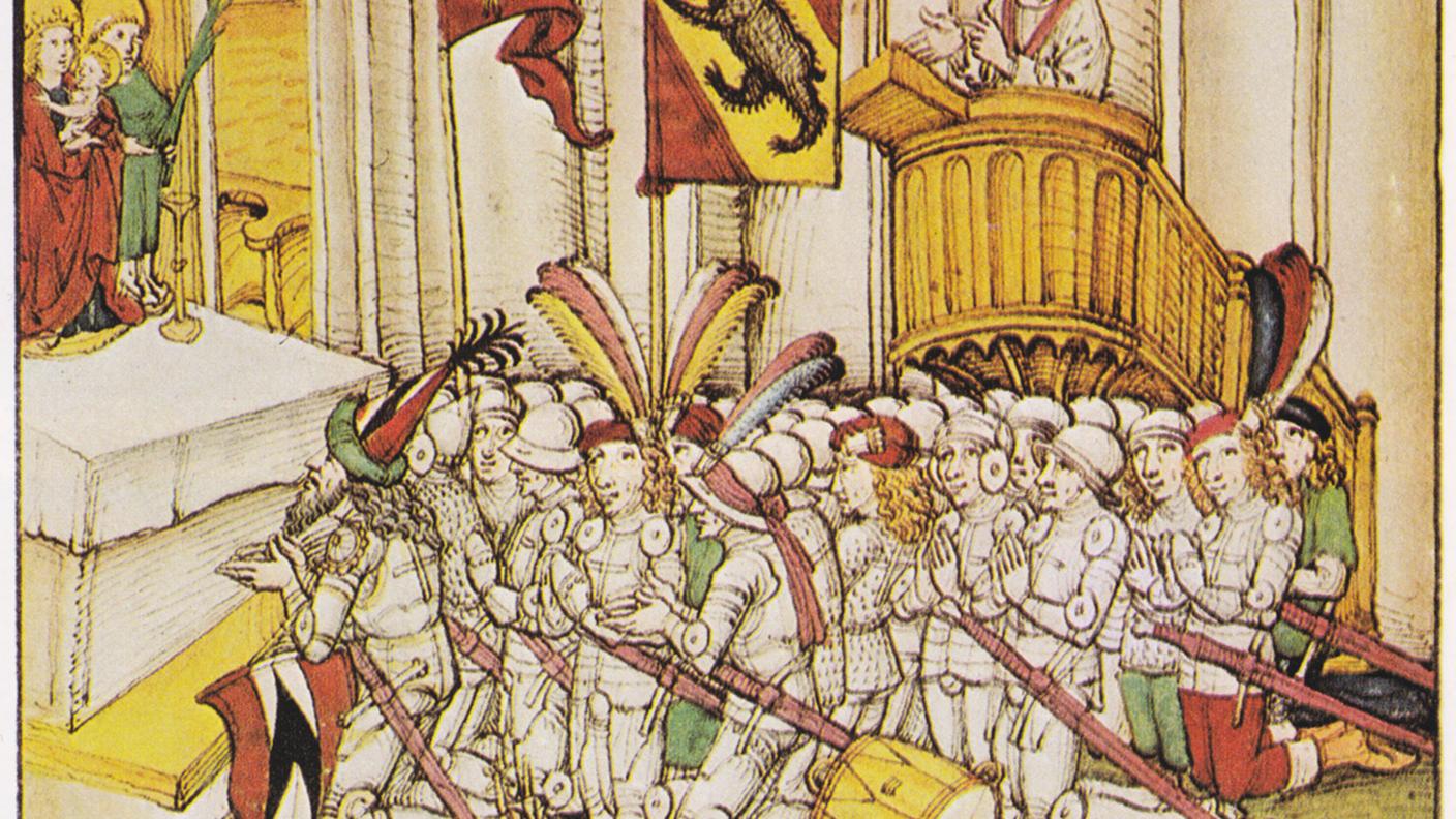 l cavaliere Rudolf von Erlach, comandante dei bernesi e dei loro alleati, s'inginocchia dinnanzi all'altare in preghiera collettiva prima della battaglia di Laupen del 1339. Lo si riconosce dall'arme della famiglia von Erlach. Dalla Spiezer Chronik del 1485