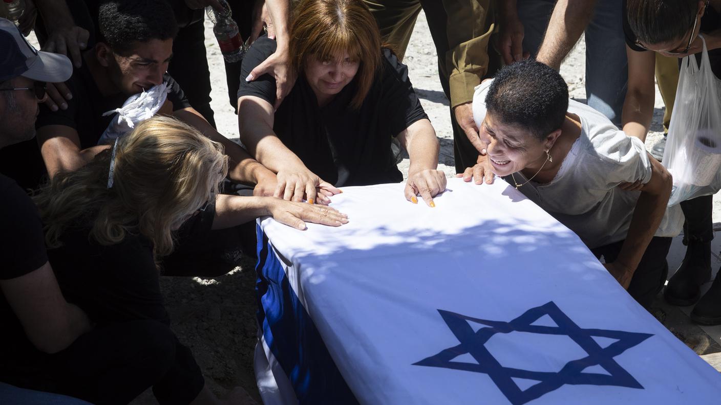 Relatives of Israeli soldier Omer Tabib, 21, mourn during his funeral at the cemetery in the northern Israeli town of Elyakim, Thursday, May 13,.jpg