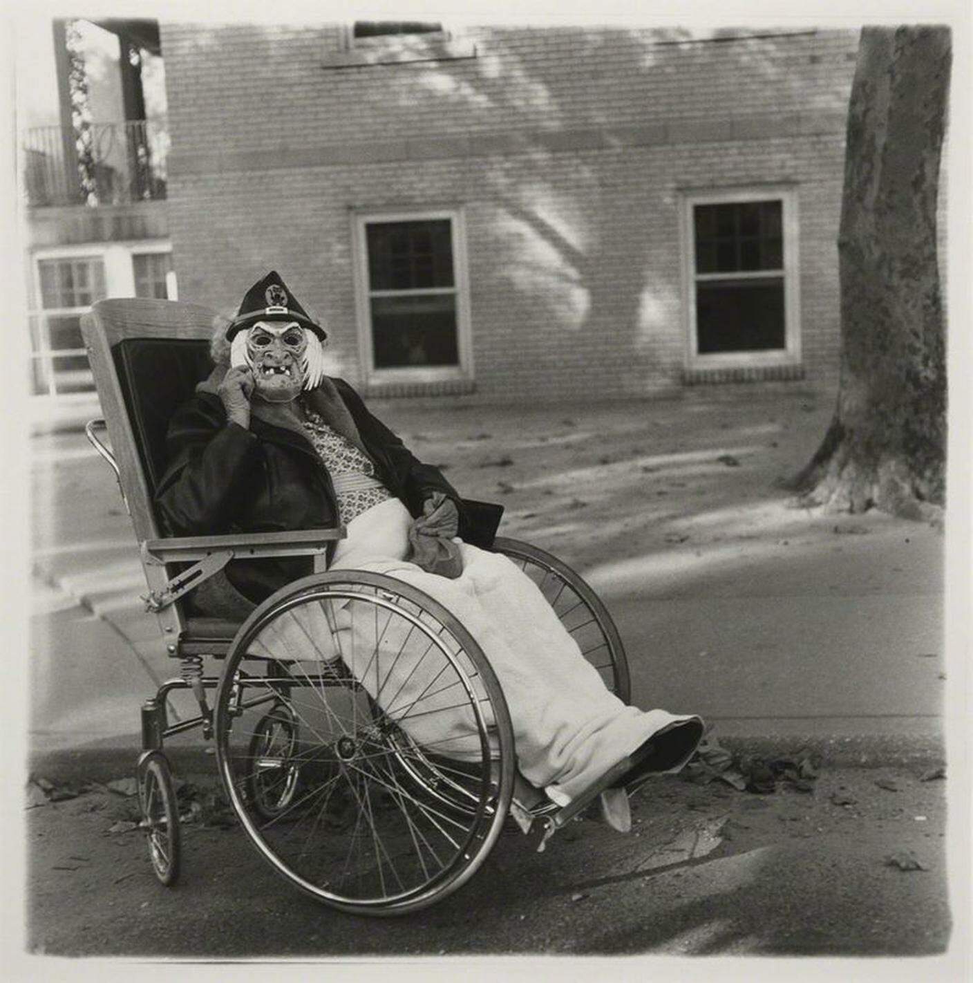 Diane Arbus, Masked woman in a wheelchair, PA. 1970. ╕ The Estate of Diane Arbus.jpg