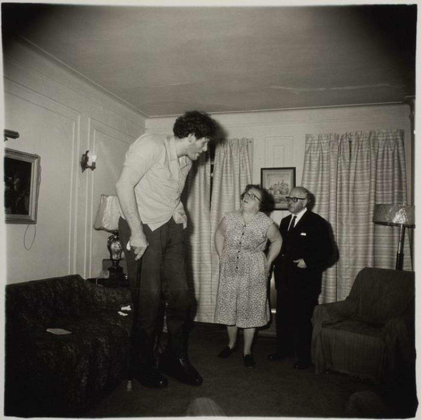 Diane Arbus, A Jewish giant at home with his parents in the Bronx, N.Y. 1970. ╕ The Estate of Diane Arbus.jpg