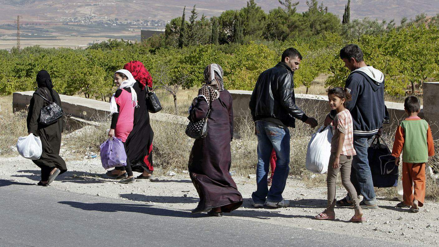 Famiglia siriana in viaggio verso un luogo "più sicuro"