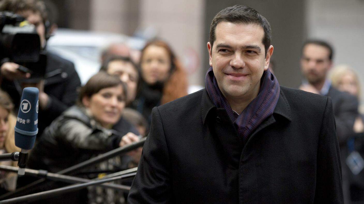 ky_Greek Prime Minister Alexis Tsipras waves as he arrives for an EU summit in Brussels on Thursday, March 19, 2015.JPG