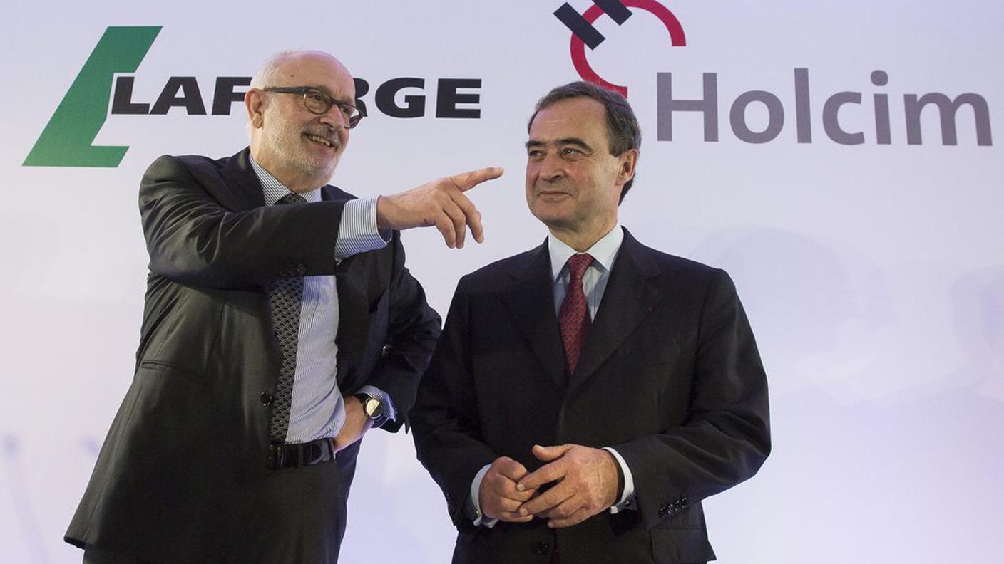 A sinistra Rolf Soiron  e Bruno Lafont  dopo l'ufficializzazione della fusione a Parigi