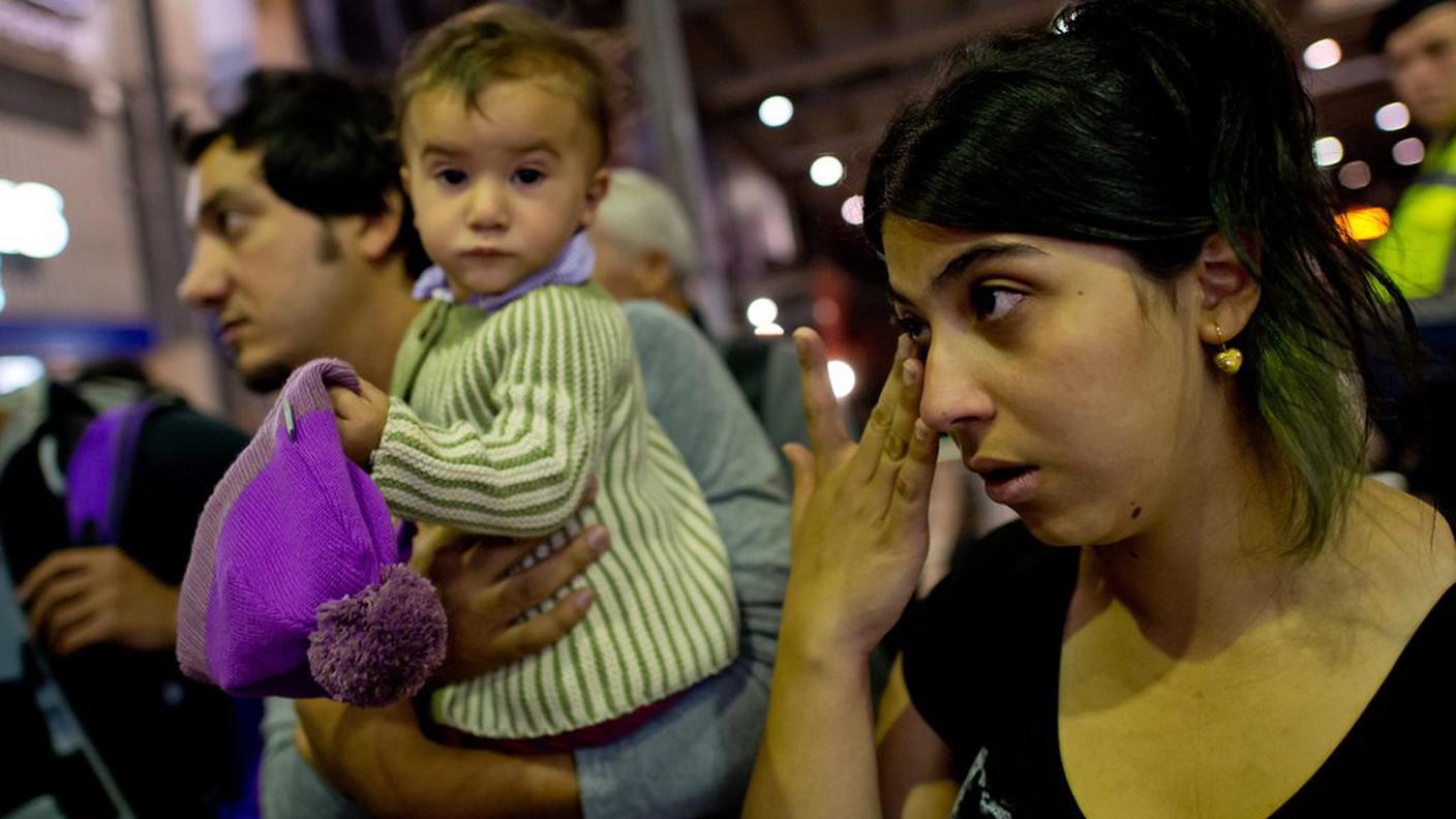 Una famiglia siriana alla stazione di Monaco