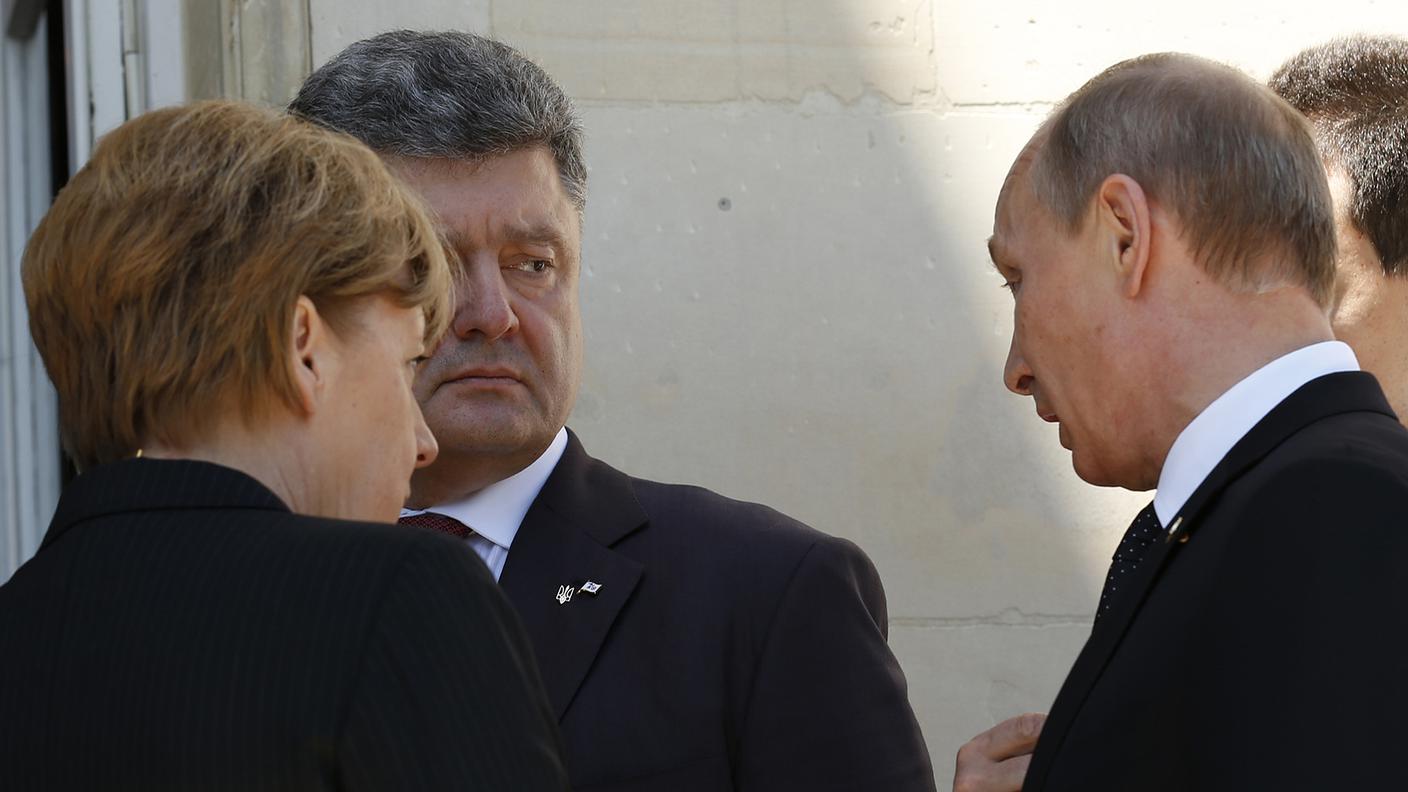 I principali protagonisti Angela Merkel, Petro Poroshenko e Vladimir Putin