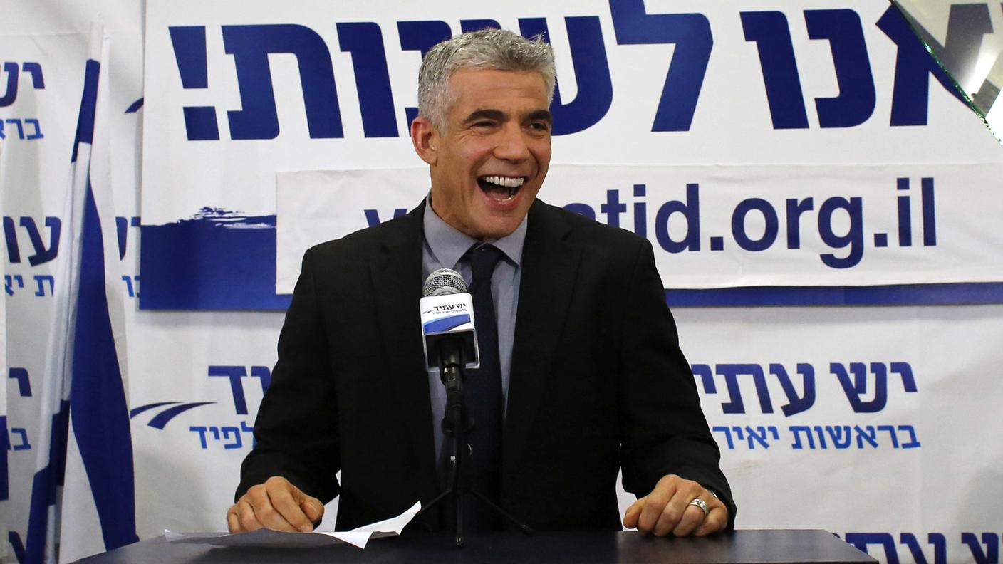 israele Lapid, leader of the Yesh Atid party, addresses supporters at his party's headquarters in Tel Aviv rt.jpg