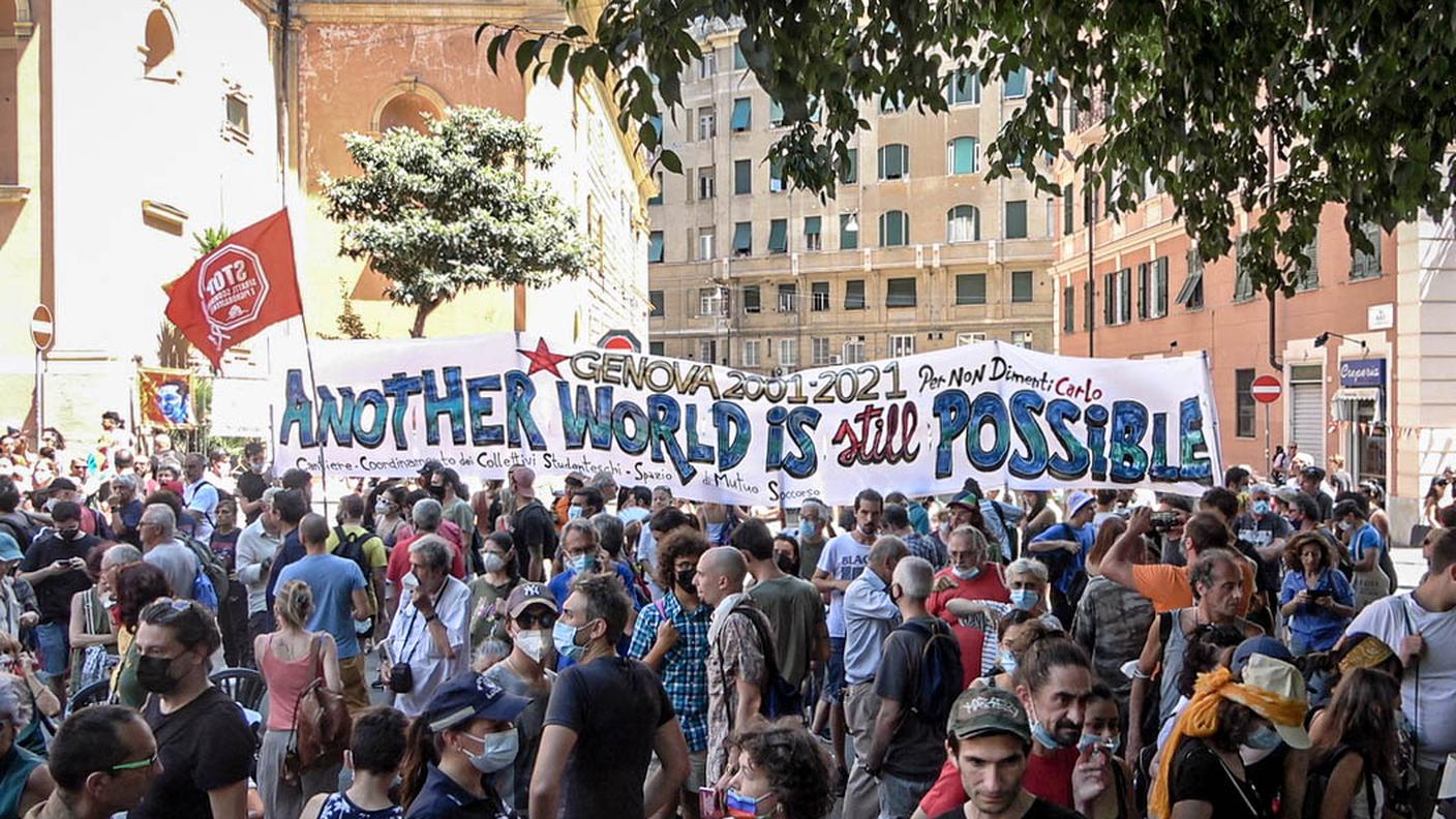 Another world is still possible, lo slogan del 2001 riattualizzato per la commemorazione di Carlo Giuliani in Piazza Alimonda, a Genova