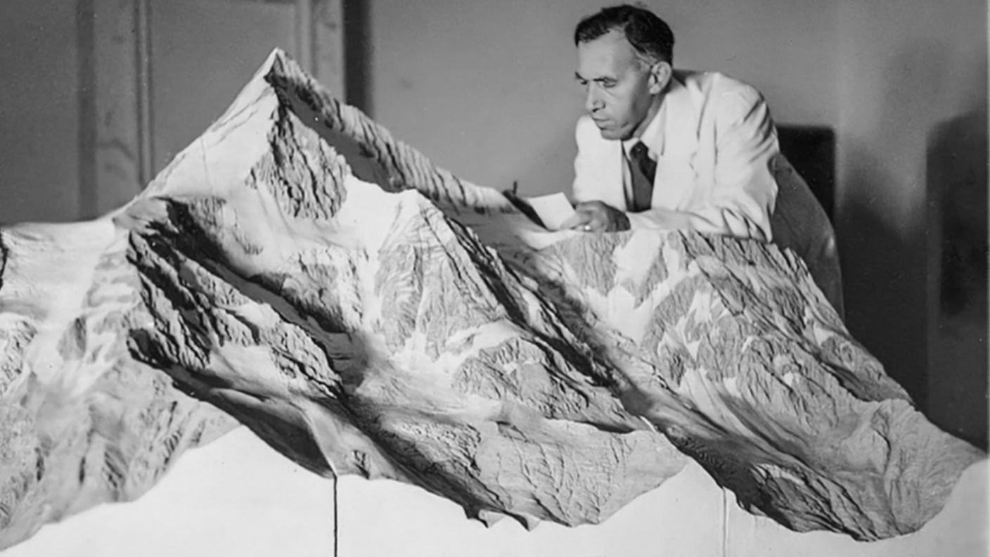 Eduard Imhof carrying out renovation work on the Bietschhorn relief model, around 1950 (IKG).png