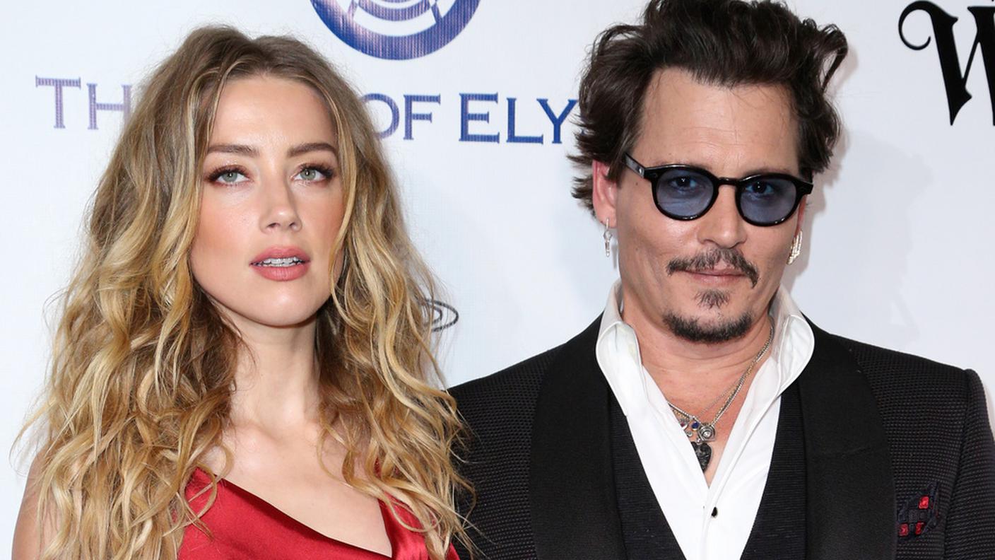 L'attore con l'ex moglie Amber Heard