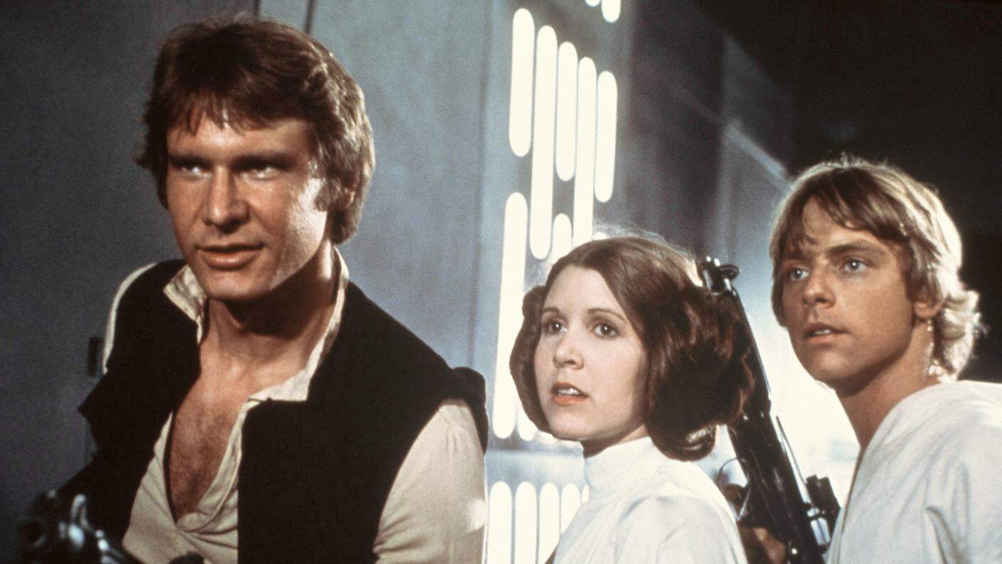 Carrie Fisher con Harrison Ford e Mark Hamill nei panni della principessa Leila