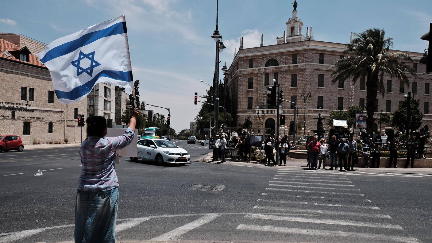 A woman with an Israeli flag in Jerusalem