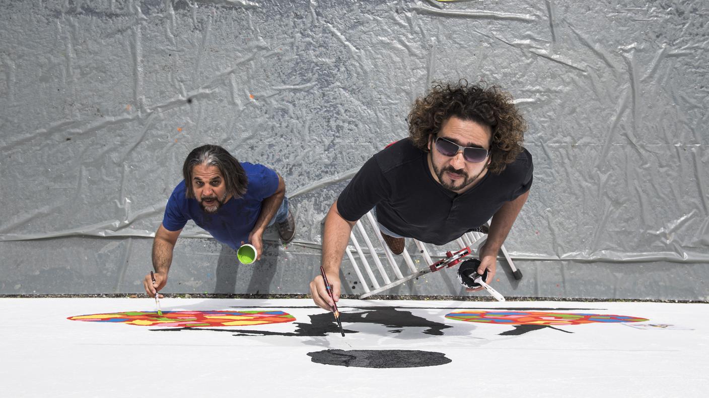 TiPress_Nella foto il duo di artisti ArtLords arrivati dall'Afghanistan, per dipingere un murales condiviso, al Parco Tassino, da destra Omaid Sharifi e Kabir Mokamel. 