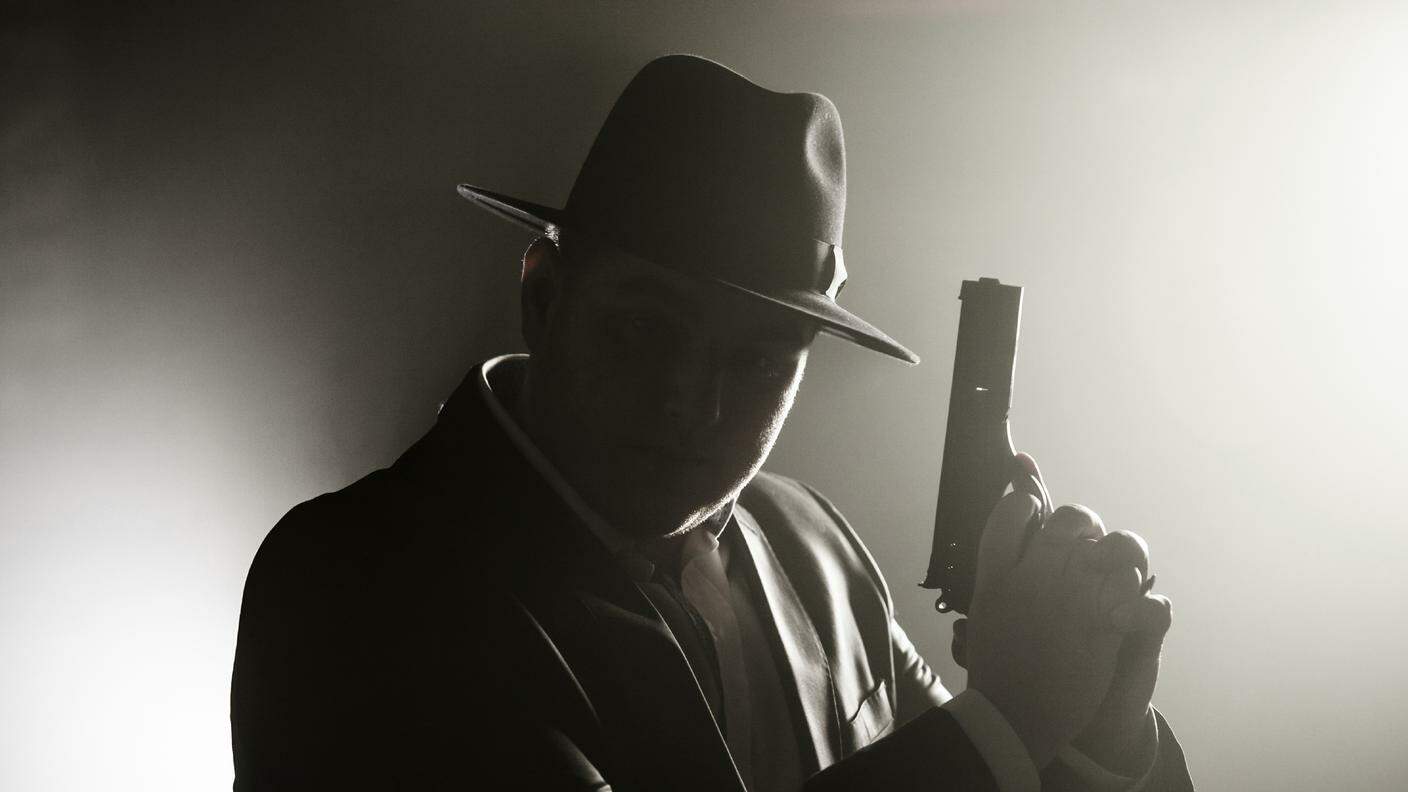 iStock_Detective, Gun, Gangster, Men, Suit