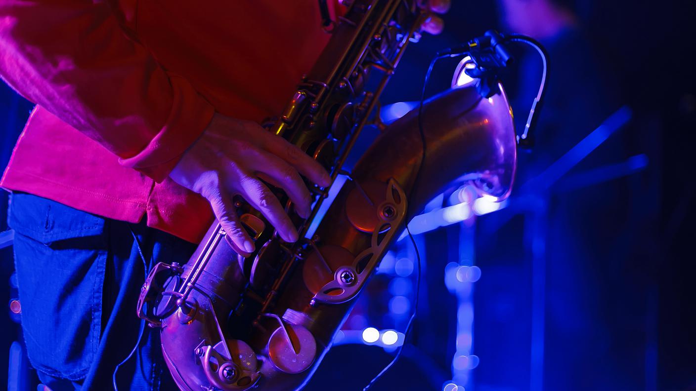 Saxophone player performing on concert 