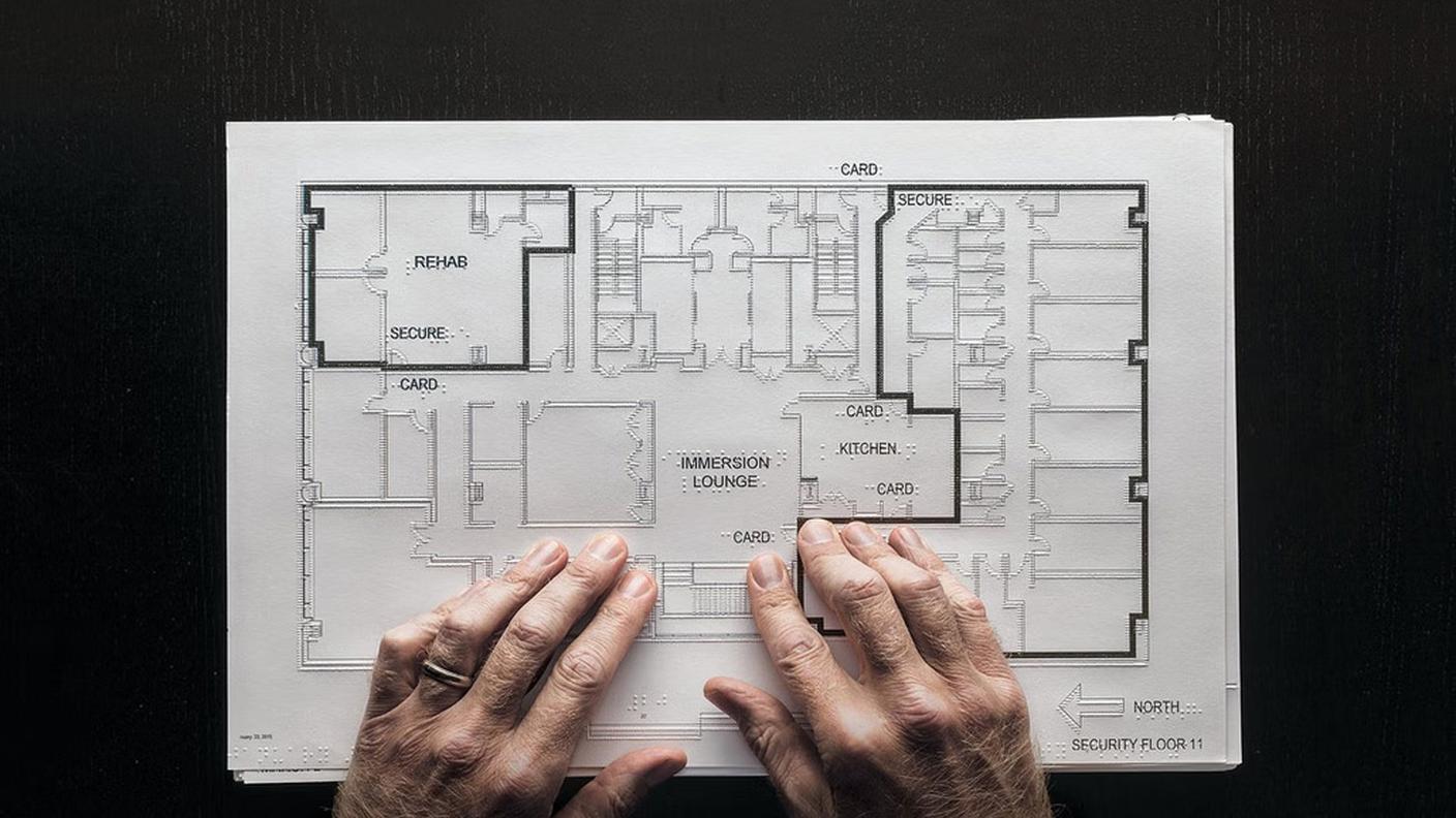 Chris reading tactile plan of the LightHouse for the Blind and Visually Impaired in San Francisco, California.