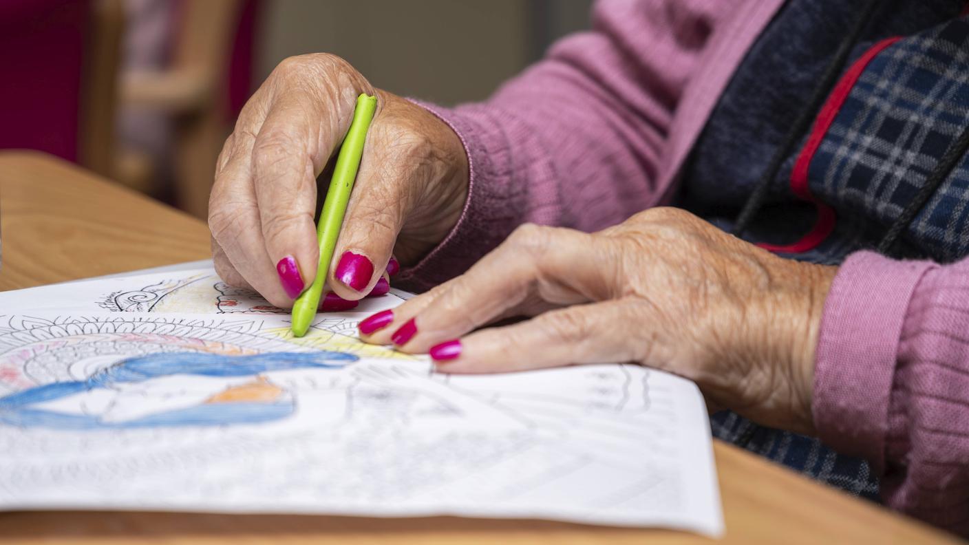 Elderly woman painting 