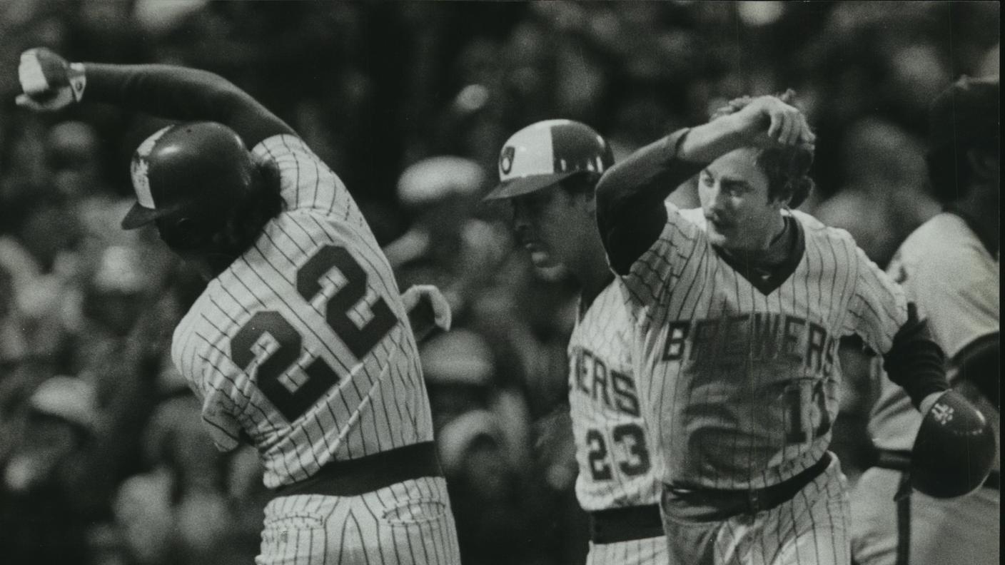 exchanged high five after scoring the tying and winning runs in the seventh inning on Cecil Cooper's single