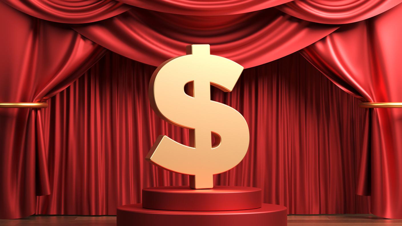 Il simbolo del dollaro color oro nella scena del teatro