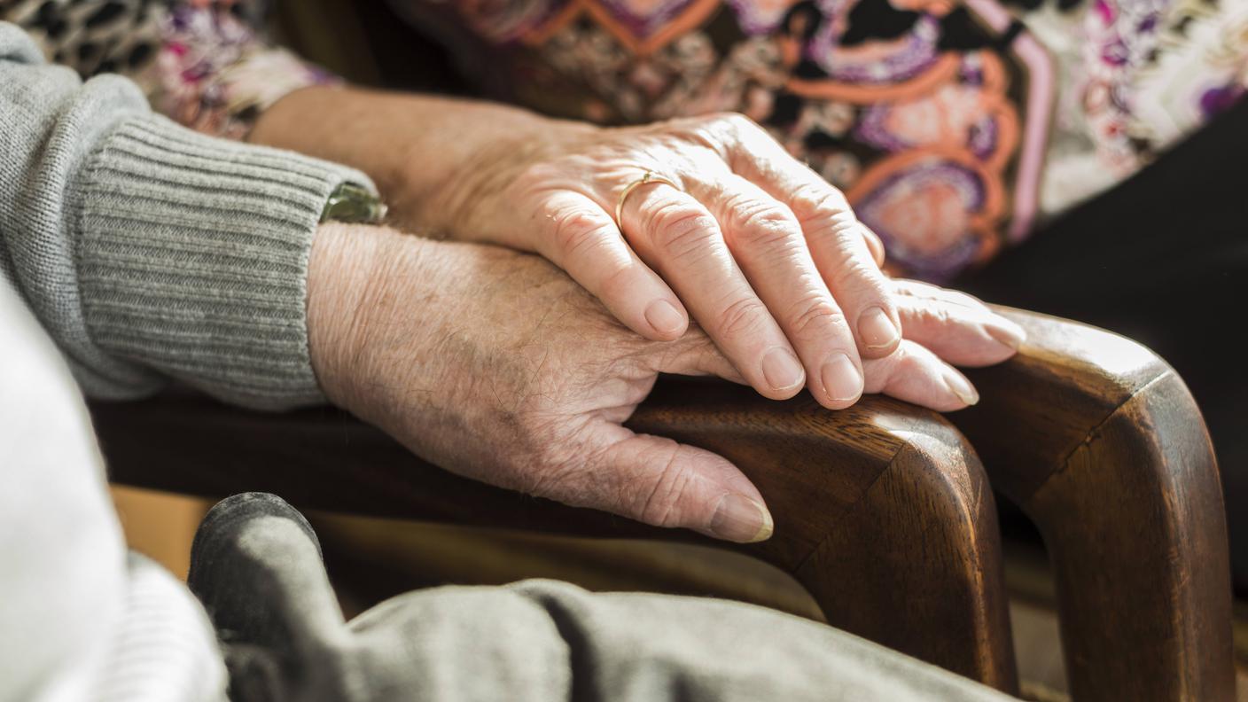 Hands of senior couple
